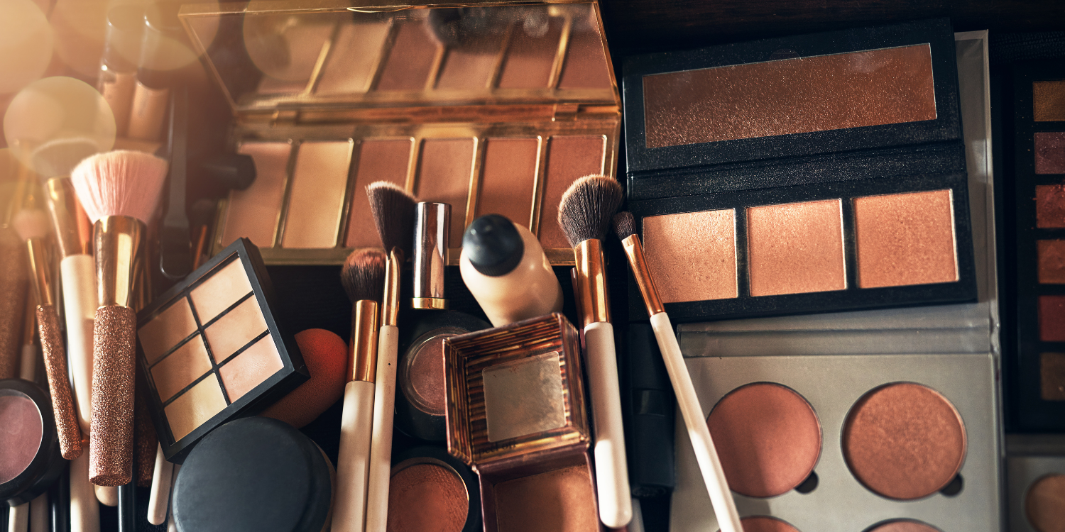 An image of makeup products and tools. The theme is how to transition your makeup from season to season without spending money.