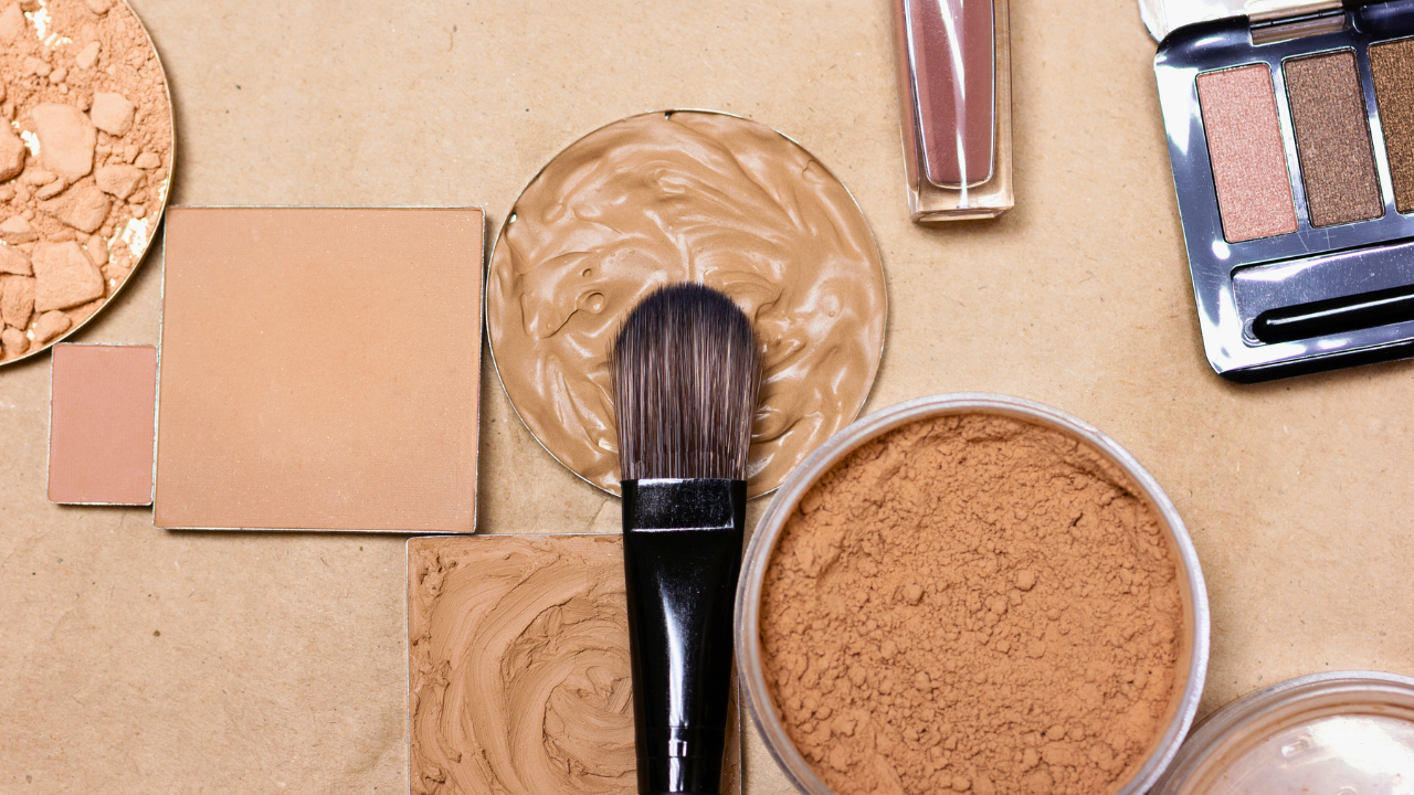 Image of makeup products and foundation brush.